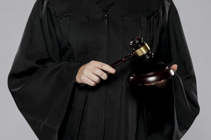 front-view-female-judge-with-gavel-1.jpg